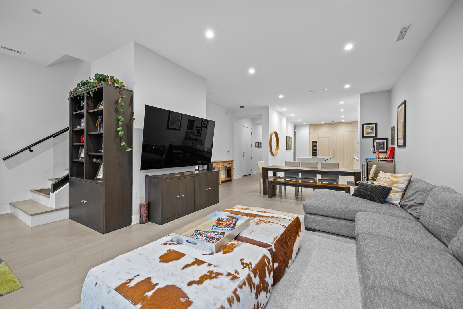 305 South Racine Avenue, Unit PHD Chicago, IL 60607 - Photo 2 of 41 a living room with furniture and a flat screen tv