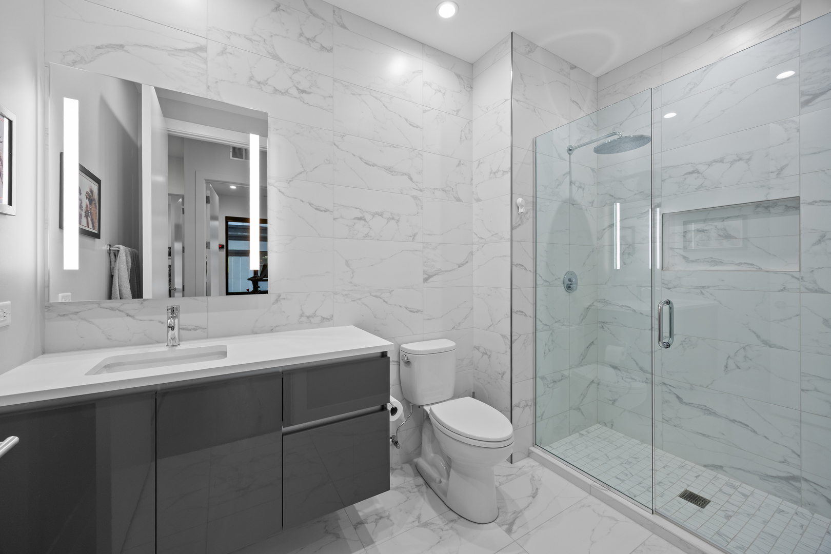 305 South Racine Avenue, Unit PHD Chicago, IL 60607 - Photo 25 of 41 a bathroom with a toilet sink and shower