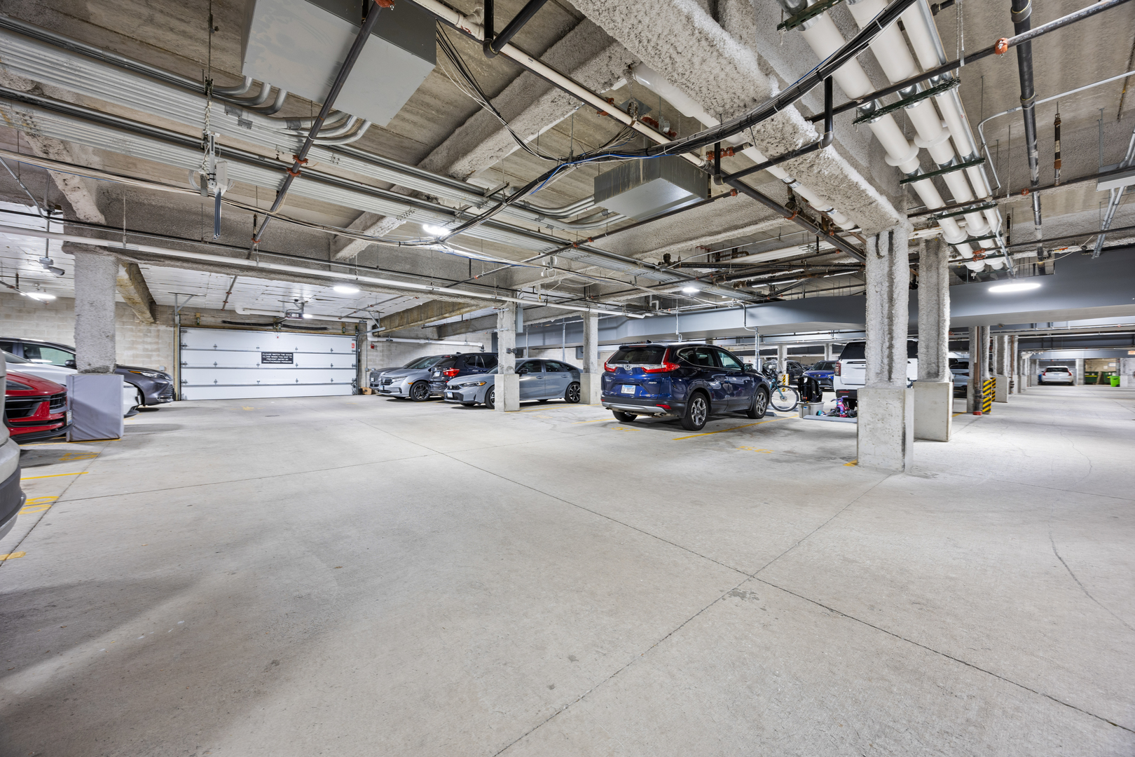 305 South Racine Avenue, Unit PHD Chicago, IL 60607 - Photo 41 of 41 a view of parking garage with cars