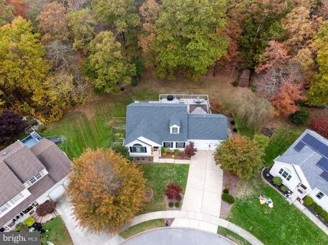 an aerial view of a house with outdoor space