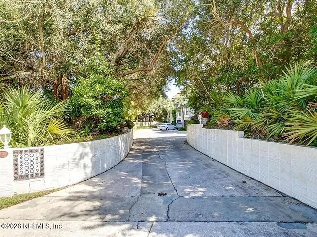 a view of an entryway with wooden floor and stairs