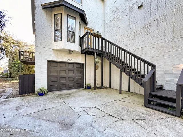 a room with furniture and a flat screen tv
