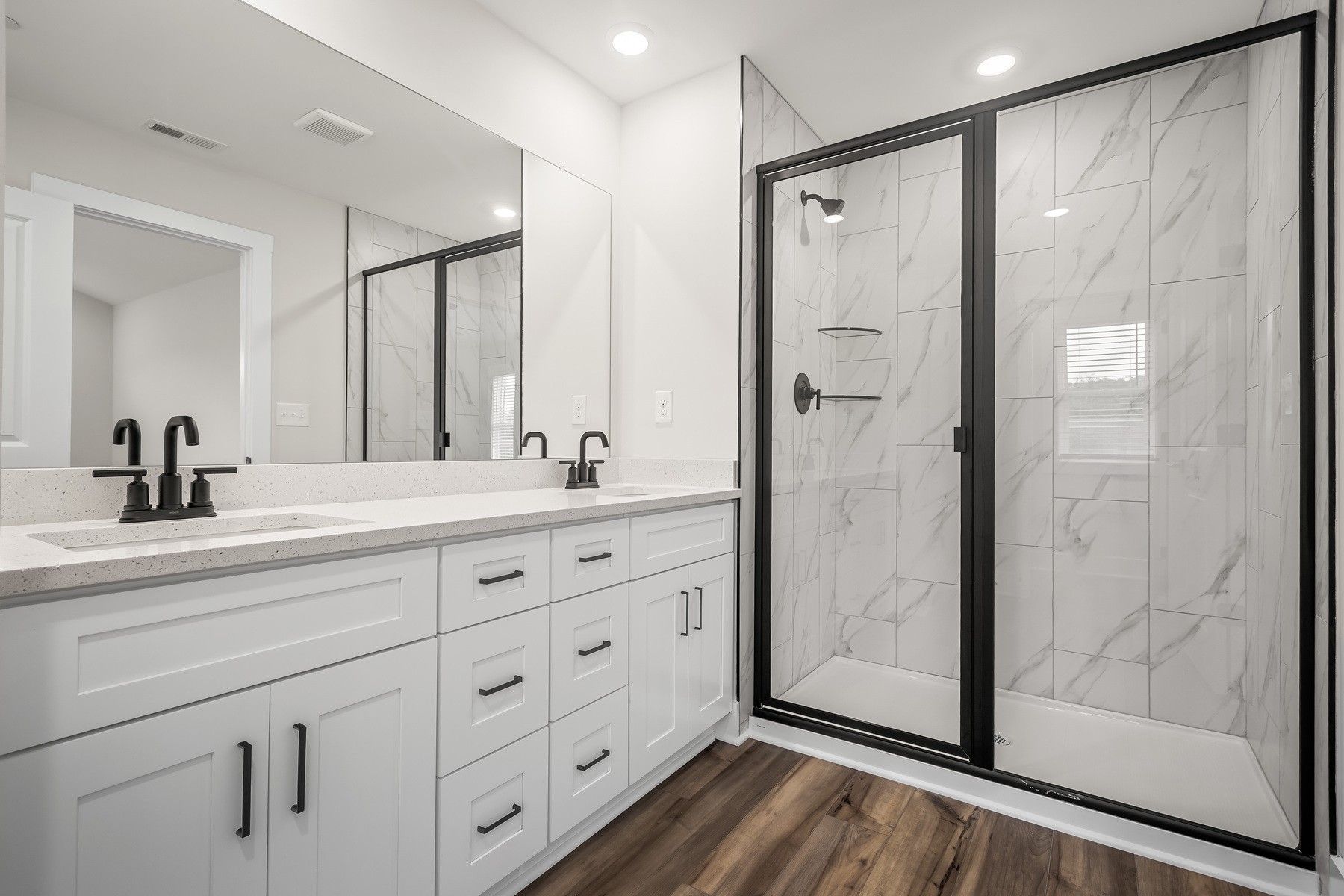 4015 Norman Drive Spring Hill, TN 37174 - Photo 8 of 11 a bathroom with a double vanity sink mirror and shower