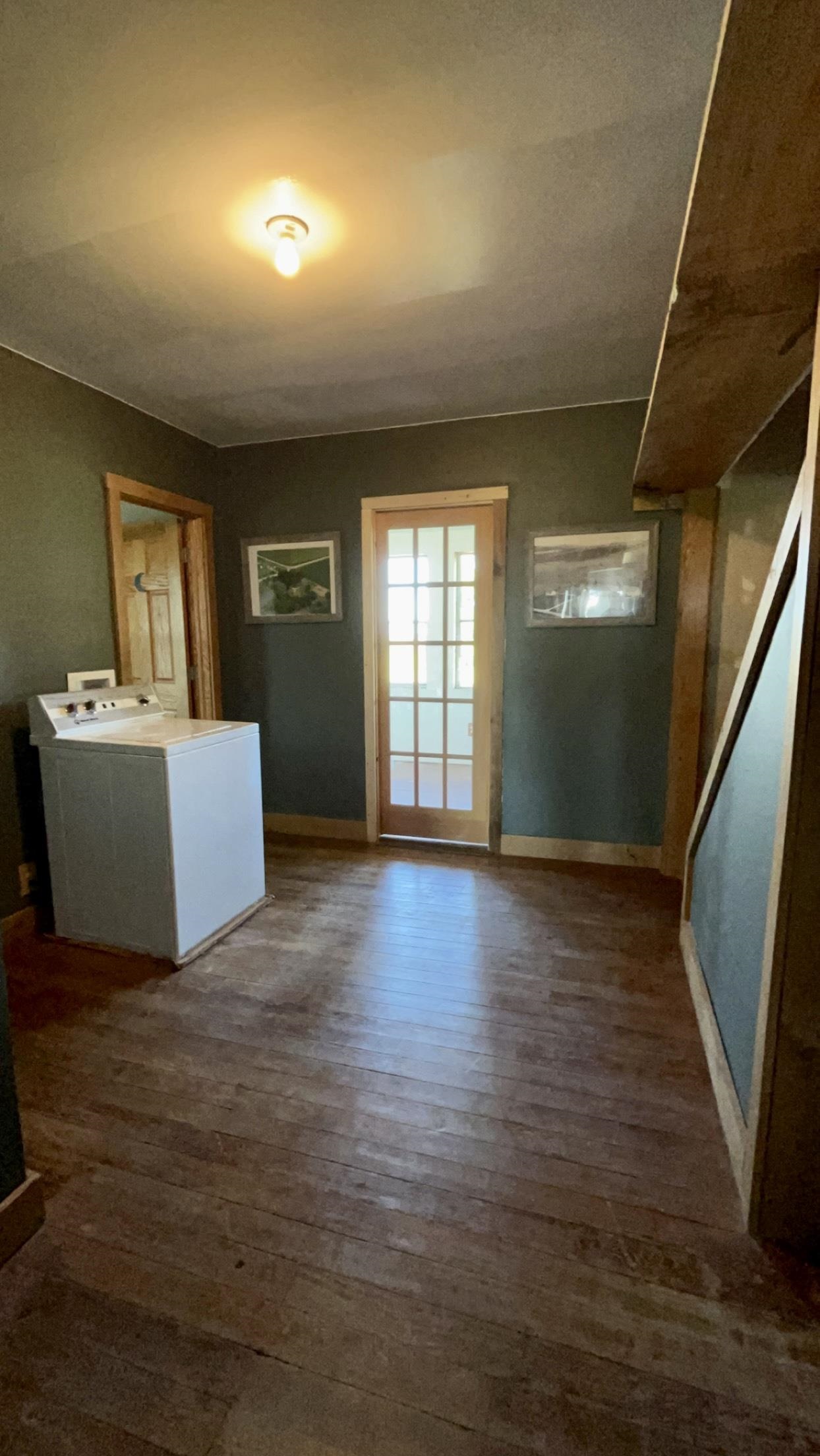 6070 Dewane Road Belvidere, IL 61008 - Photo 16 of 30 a view of an empty room with wooden floor and a window