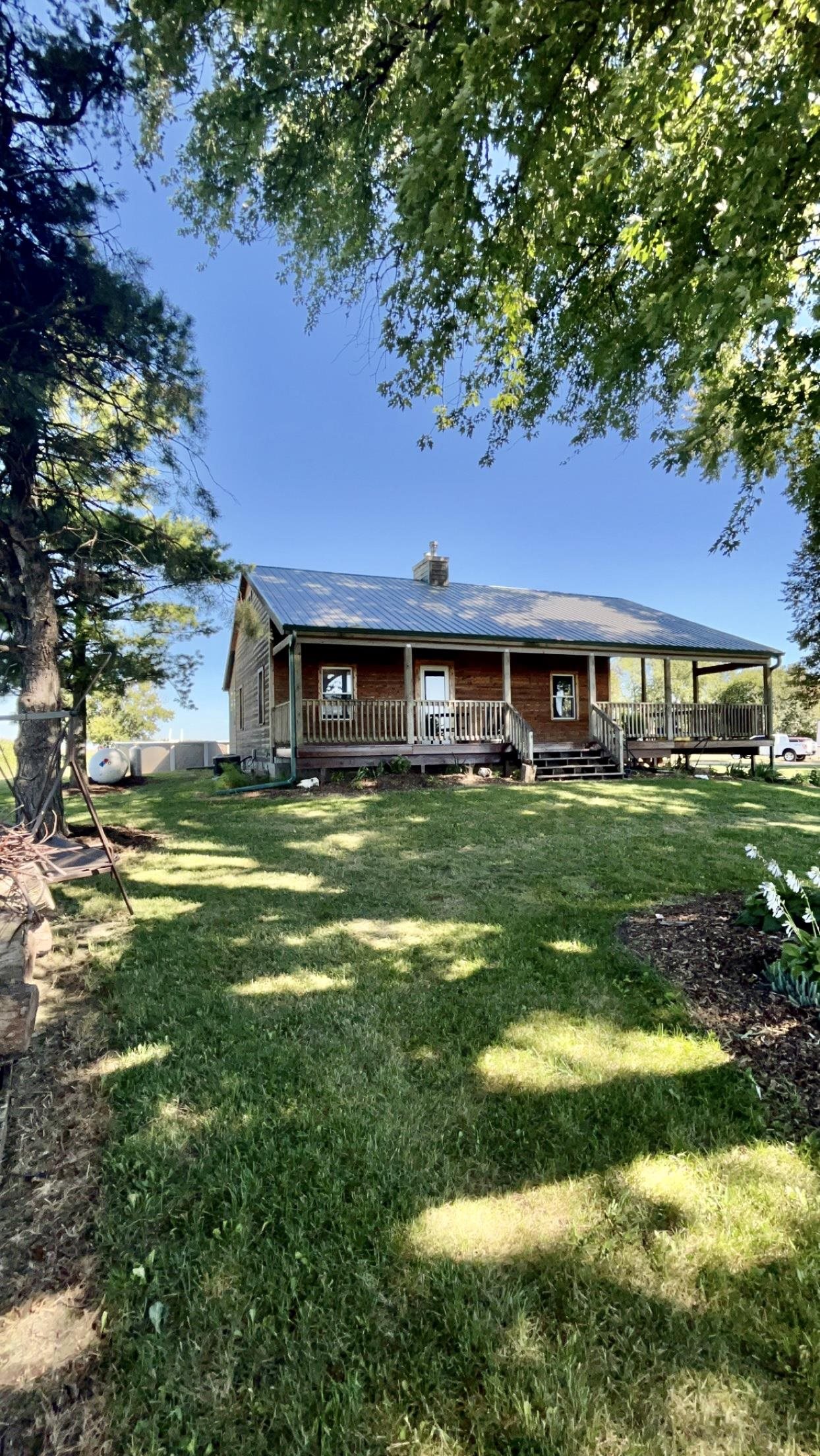6070 Dewane Road Belvidere, IL 61008 - Photo 2 of 30 a front view of a house with a yard