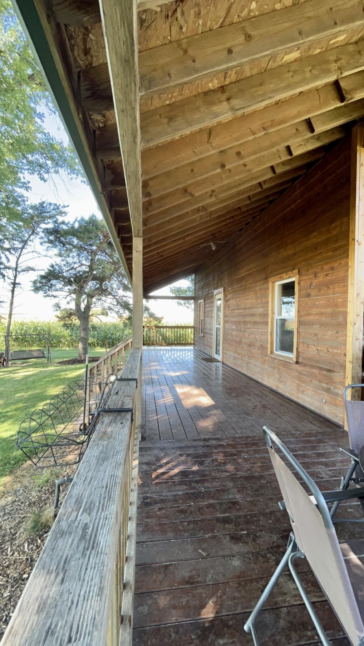 6070 Dewane Road Belvidere, IL 61008 - Photo 5 of 30 a view of a backyard with wooden floor