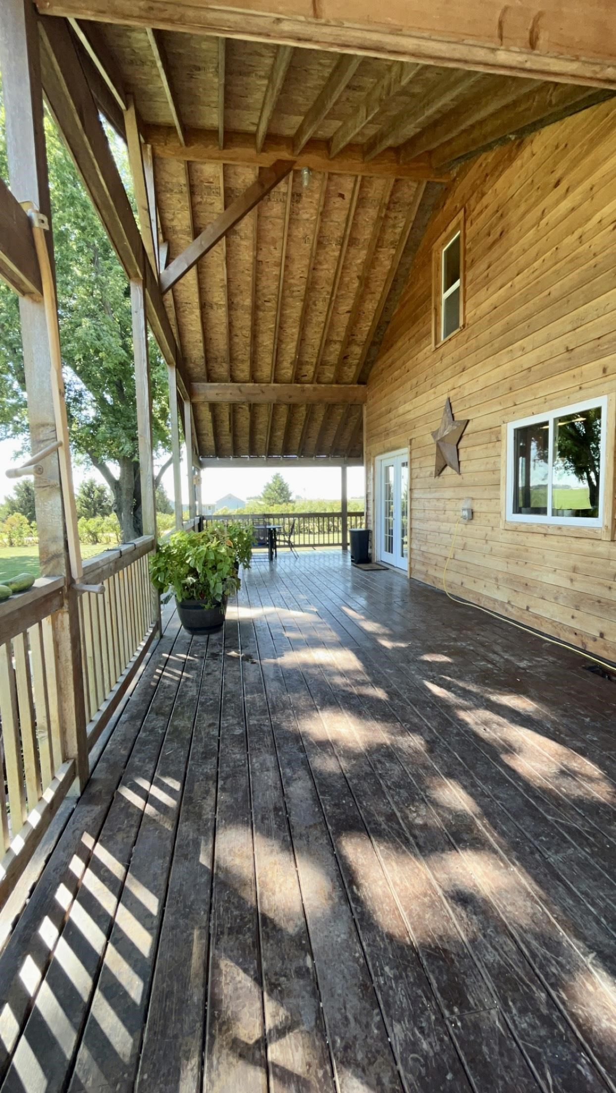6070 Dewane Road Belvidere, IL 61008 - Photo 6 of 30 a view of a porch with wooden floor