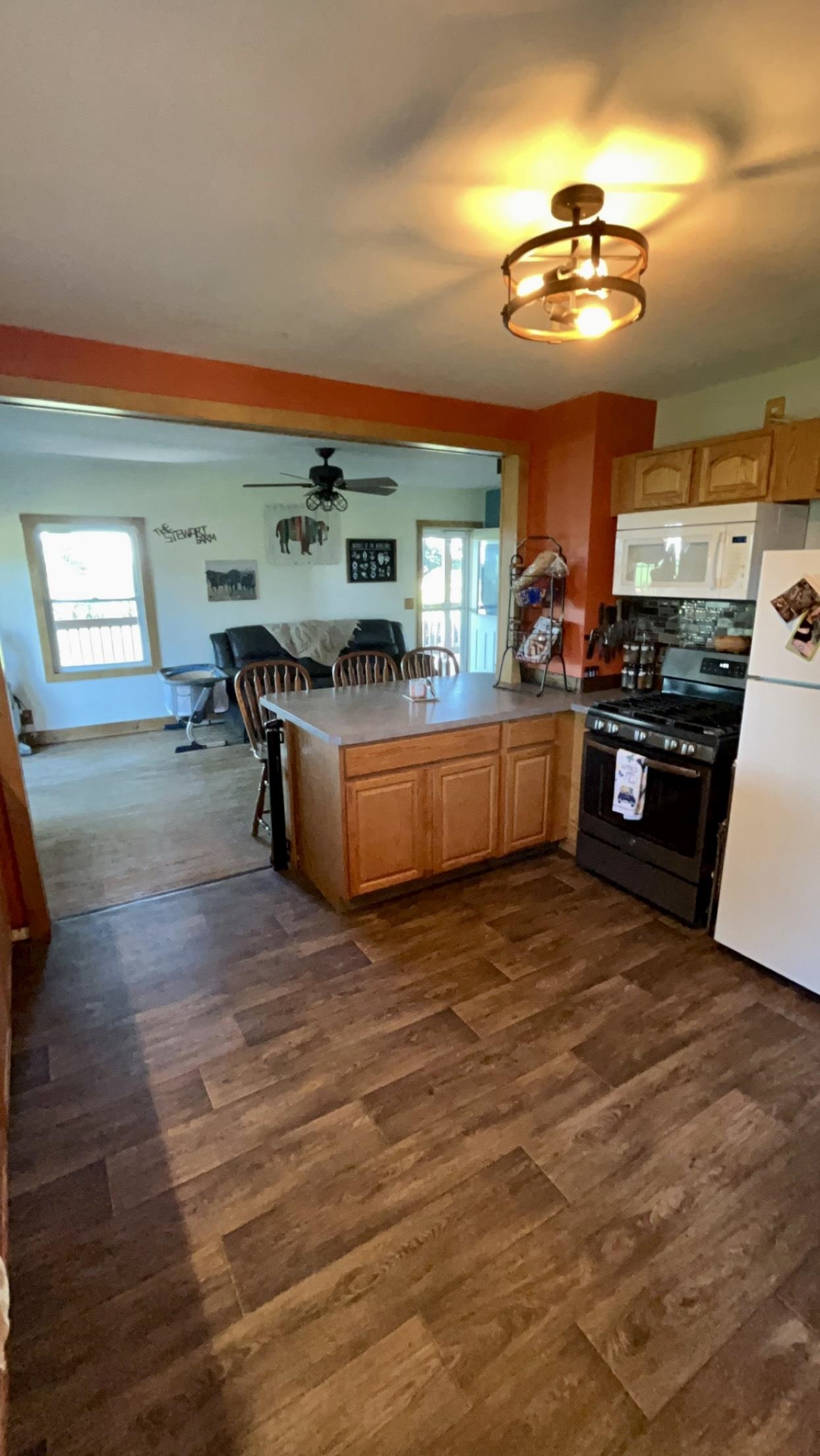 6070 Dewane Road Belvidere, IL 61008 - Photo 9 of 30 a kitchen with stainless steel appliances granite countertop a stove and a refrigerator