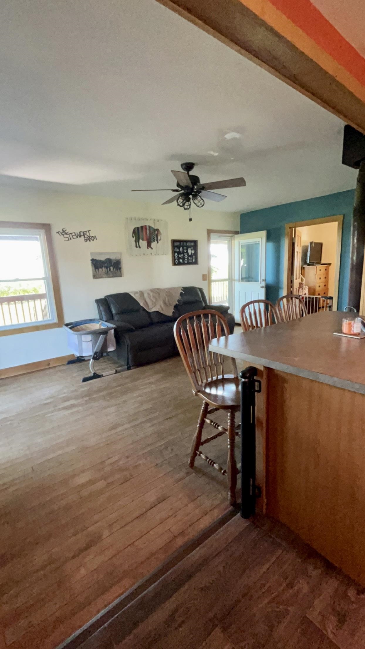 6070 Dewane Road Belvidere, IL 61008 - Photo 10 of 30 a living room with furniture and a wooden floor