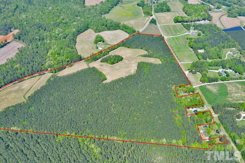 7-8 Mollie Mooney Road Roxboro, NC 27574 - Photo 2 of 7 a backyard of a house with lots of green space