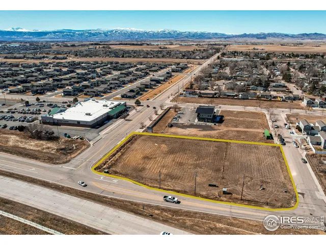 an aerial view of a residential houses with outdoor space
