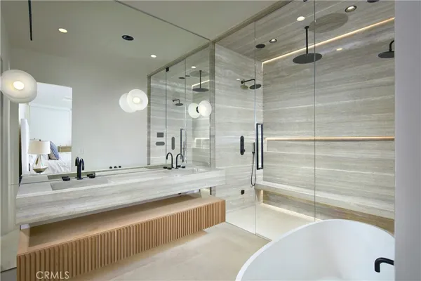 a bathroom with a tub and a sink