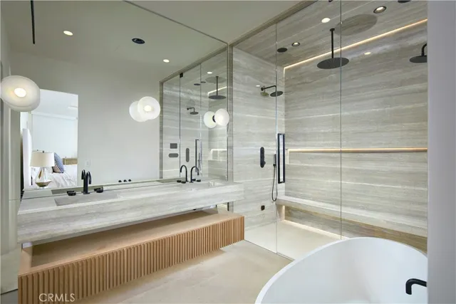 a bathroom with a tub and a sink