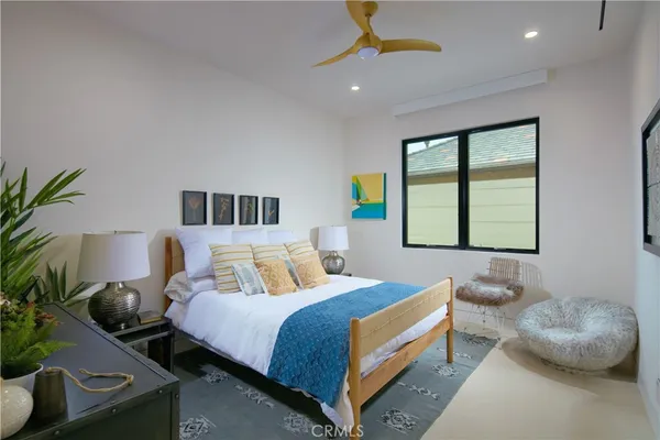 a bedroom with a bed and window