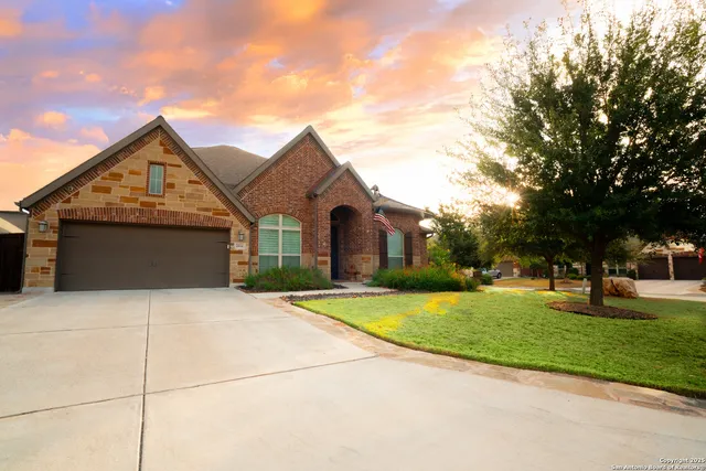a front view of house with yard and green space