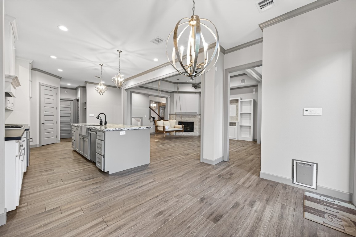 12379 Pebble View Drive Conroe, TX 77304 - Photo 11 of 49 a view of a living room and kitchen with wooden floor