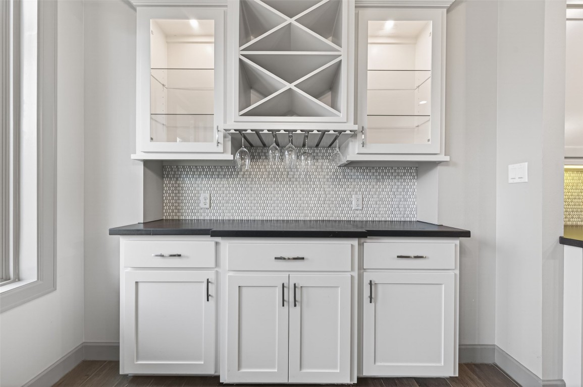 12379 Pebble View Drive Conroe, TX 77304 - Photo 12 of 49 a view of a kitchen with white cabinets and a wooden floor