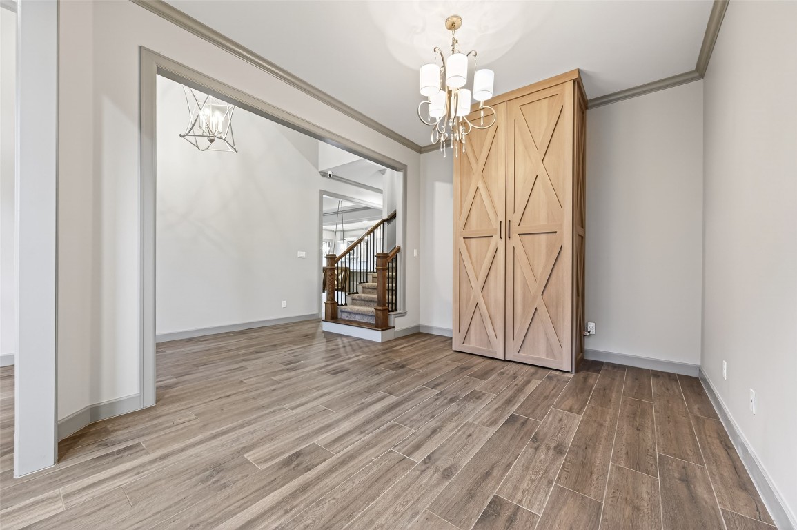 12379 Pebble View Drive Conroe, TX 77304 - Photo 21 of 49 a view of empty room with wooden floor and fan