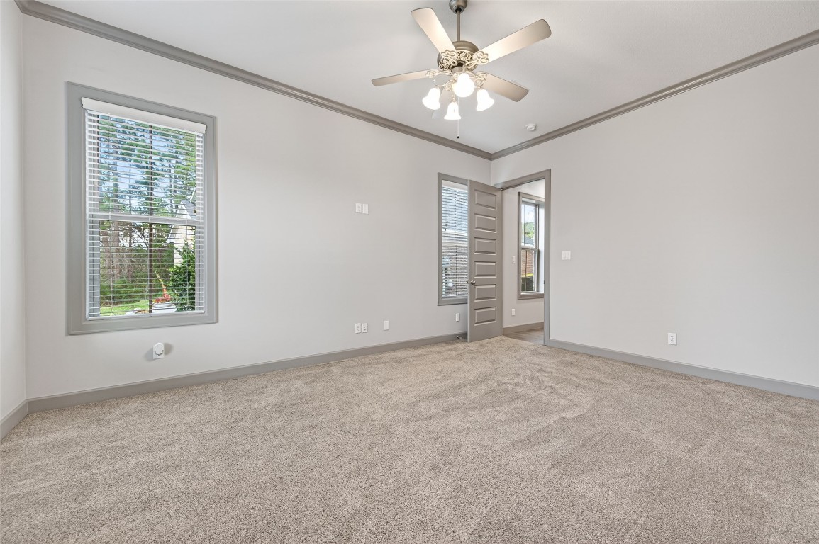 12379 Pebble View Drive Conroe, TX 77304 - Photo 22 of 49 an empty room with windows and fan