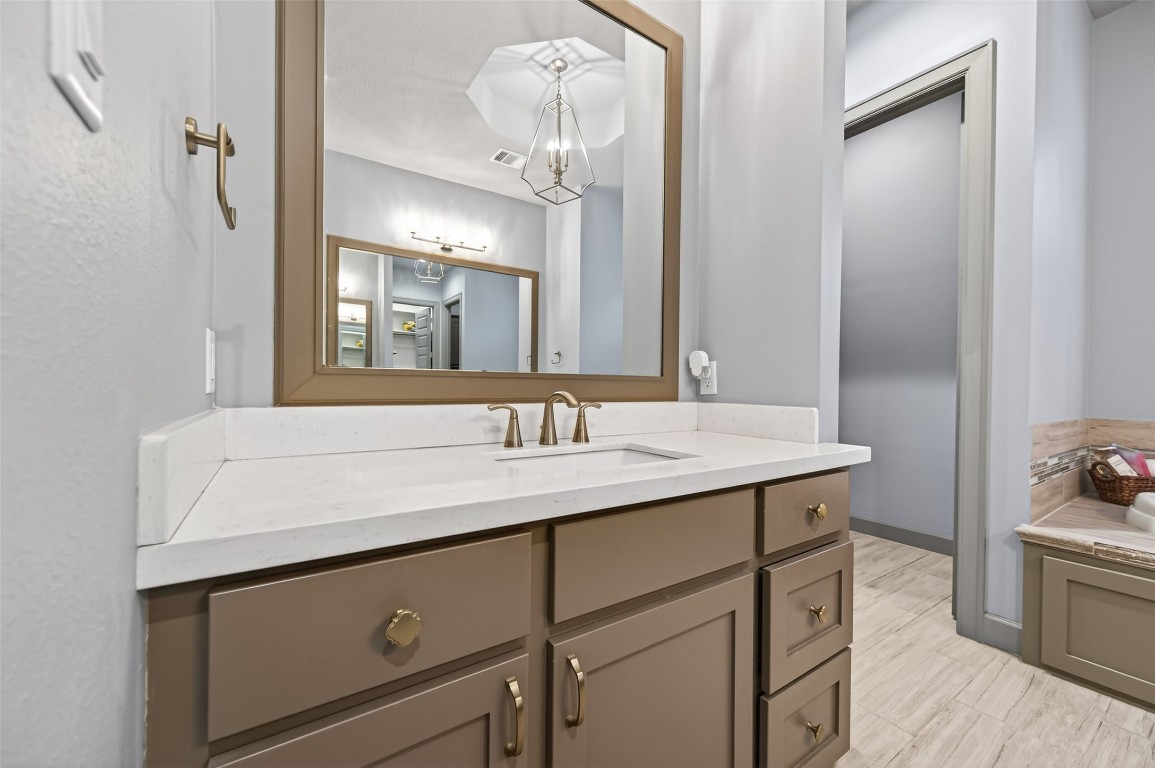 12379 Pebble View Drive Conroe, TX 77304 - Photo 28 of 49 a bathroom with a sink and a mirror