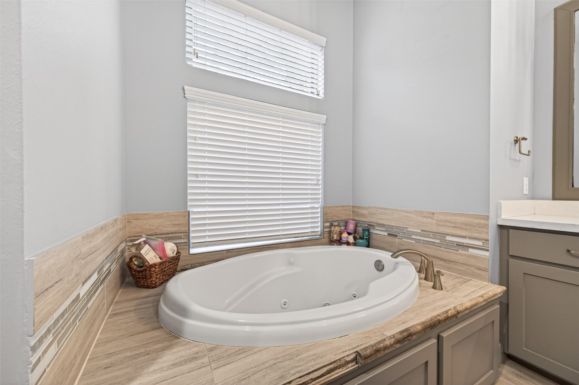 12379 Pebble View Drive Conroe, TX 77304 - Photo 29 of 49 a bathroom with a sink and a window