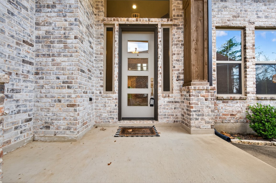 12379 Pebble View Drive Conroe, TX 77304 - Photo 3 of 49 front view of a brick house with a street
