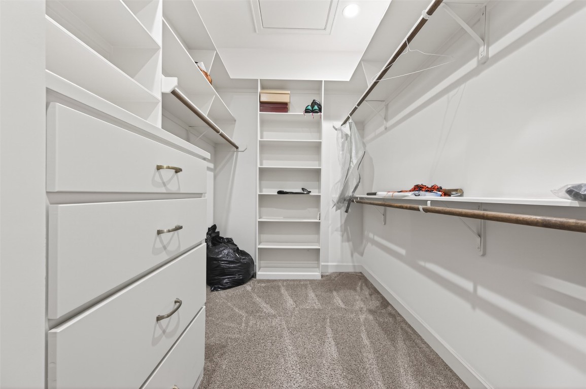 12379 Pebble View Drive Conroe, TX 77304 - Photo 32 of 49 a view of walk in closet with empty racks