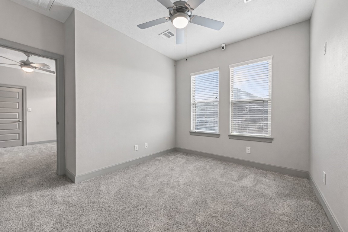 12379 Pebble View Drive Conroe, TX 77304 - Photo 33 of 49 a view of an empty room with a window