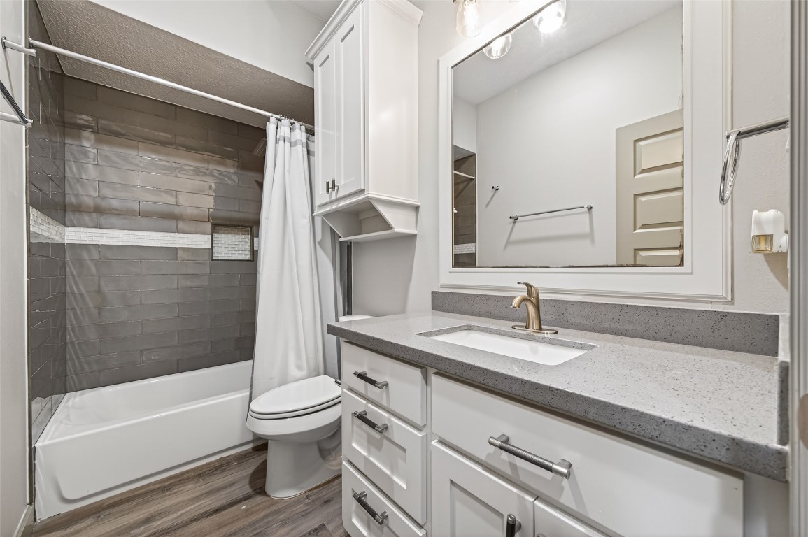 12379 Pebble View Drive Conroe, TX 77304 - Photo 35 of 49 a bathroom with a granite countertop sink toilet and shower