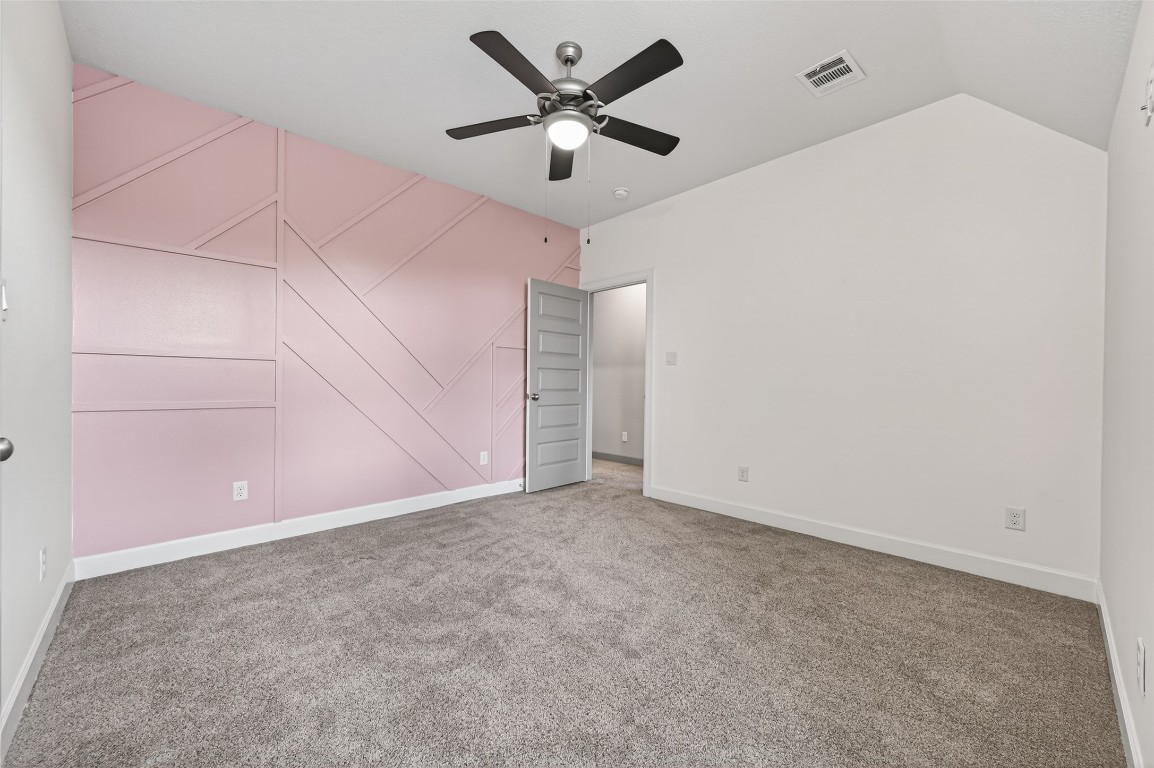 12379 Pebble View Drive Conroe, TX 77304 - Photo 36 of 49 an empty room with closet and fan