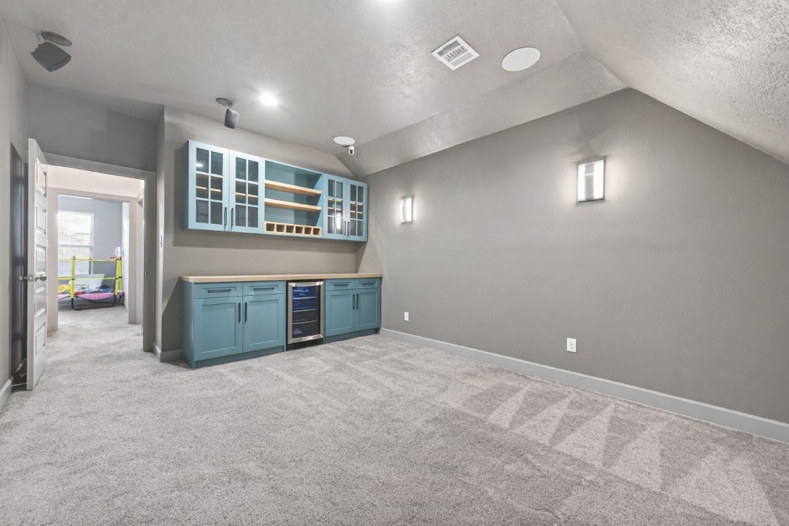 12379 Pebble View Drive Conroe, TX 77304 - Photo 37 of 49 an empty room with windows and fireplace