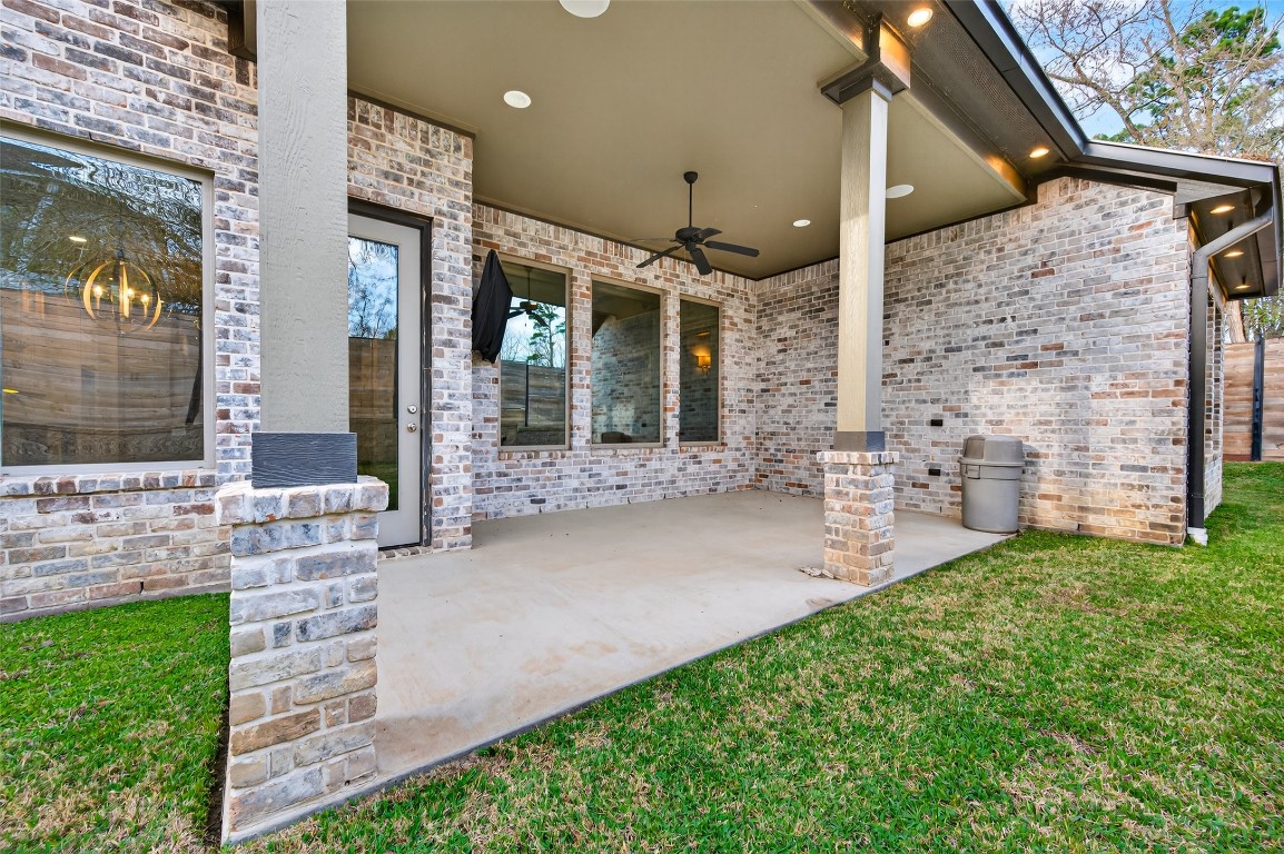 12379 Pebble View Drive Conroe, TX 77304 - Photo 39 of 49 a front view of a house with a garden