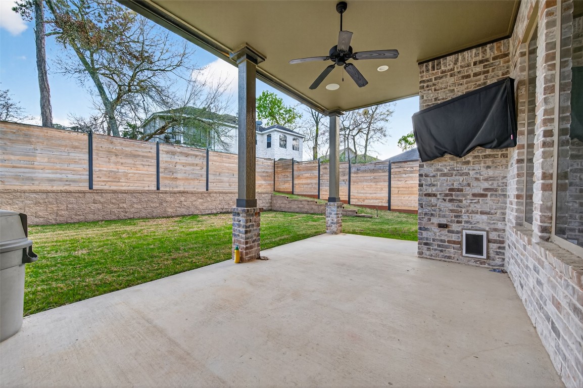 12379 Pebble View Drive Conroe, TX 77304 - Photo 40 of 49 a view of a backyard with a garden