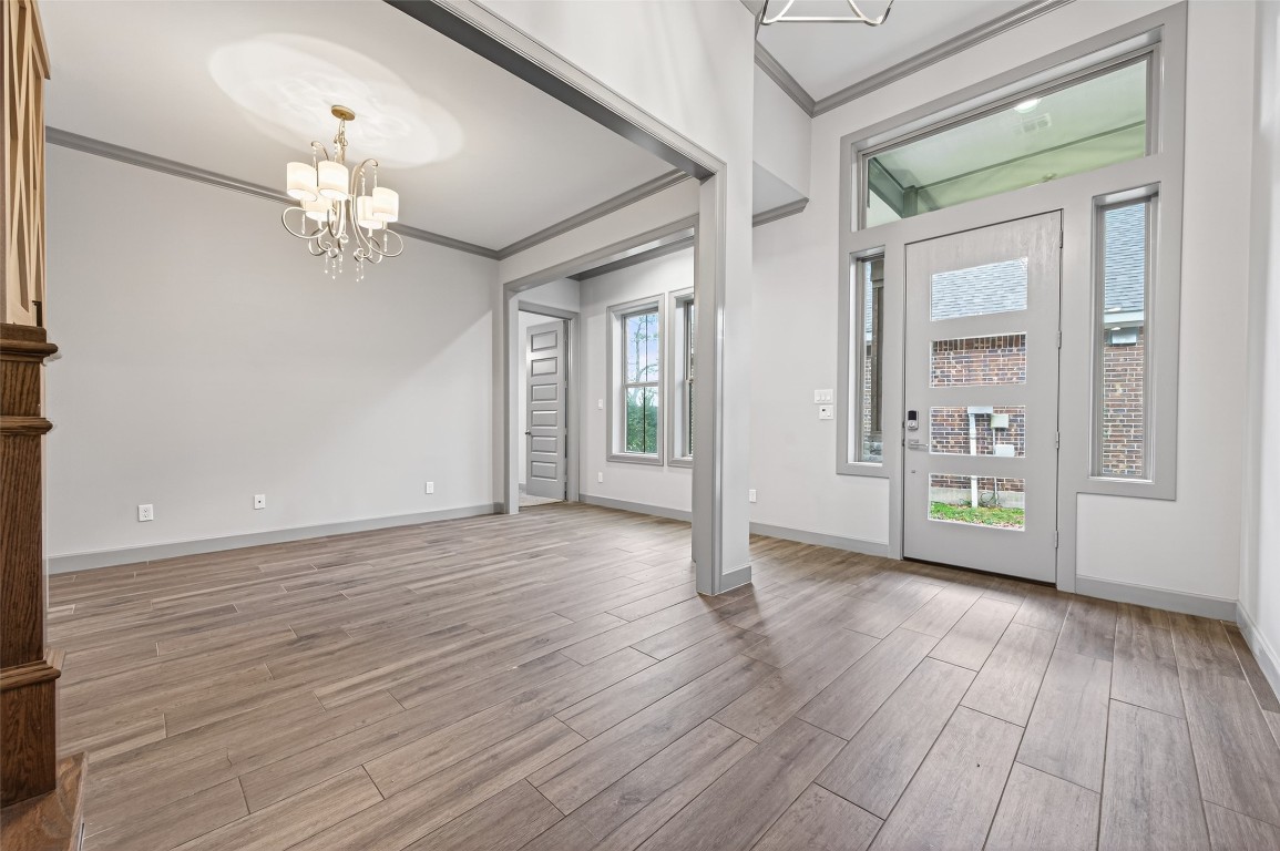 12379 Pebble View Drive Conroe, TX 77304 - Photo 4 of 49 wooden floor in an empty room with a window