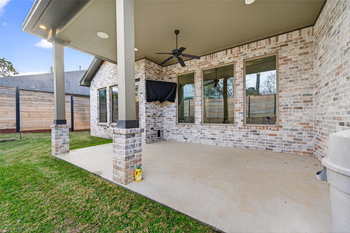 12379 Pebble View Drive Conroe, TX 77304 - Photo 41 of 49 a front view of a house with a yard