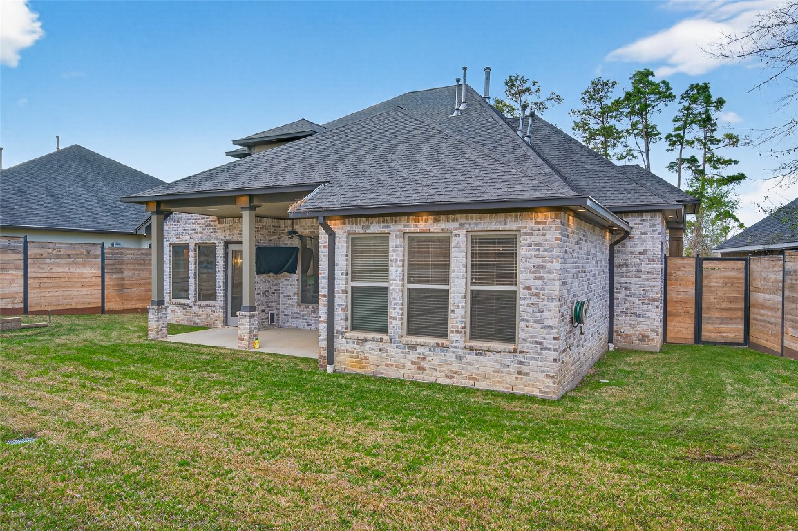 12379 Pebble View Drive Conroe, TX 77304 - Photo 44 of 49 front view of a house with a yard