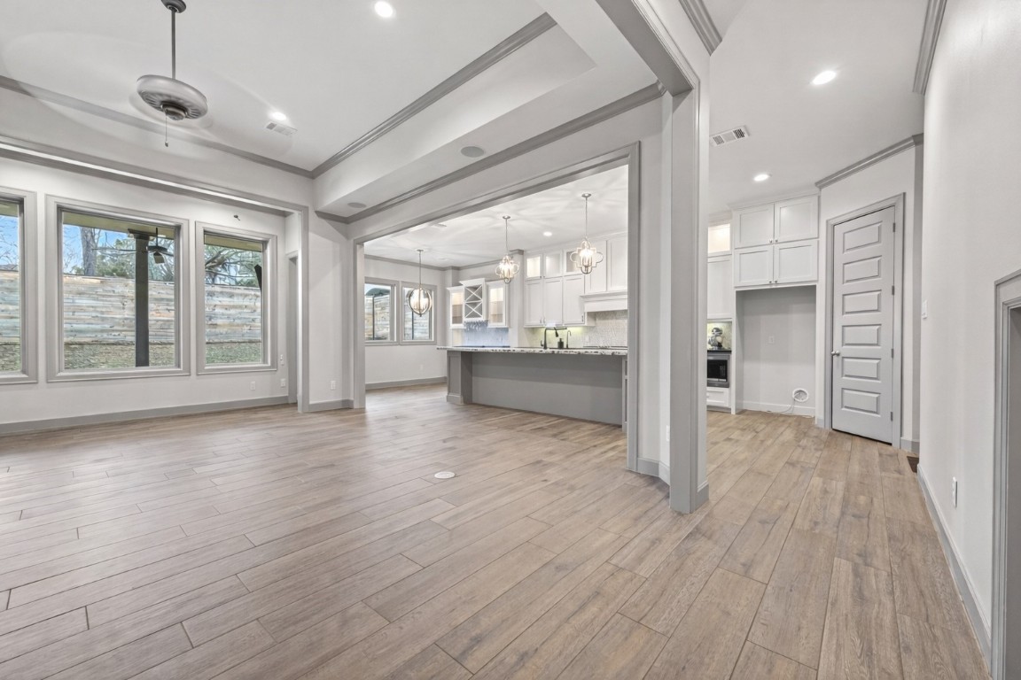 12379 Pebble View Drive Conroe, TX 77304 - Photo 6 of 49 a view of a big room with wooden floor and windows