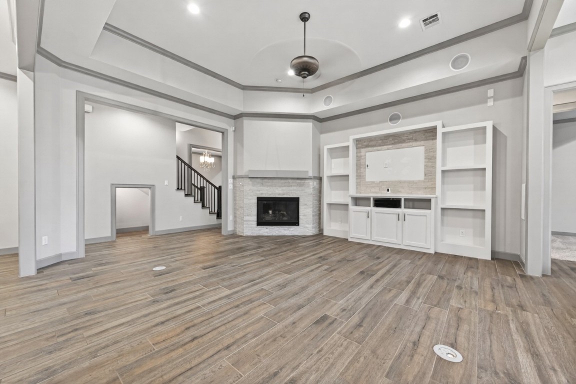 12379 Pebble View Drive Conroe, TX 77304 - Photo 7 of 49 a view of empty room with wooden floor and fireplace