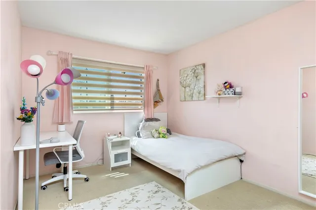 a bedroom with a bed and a table