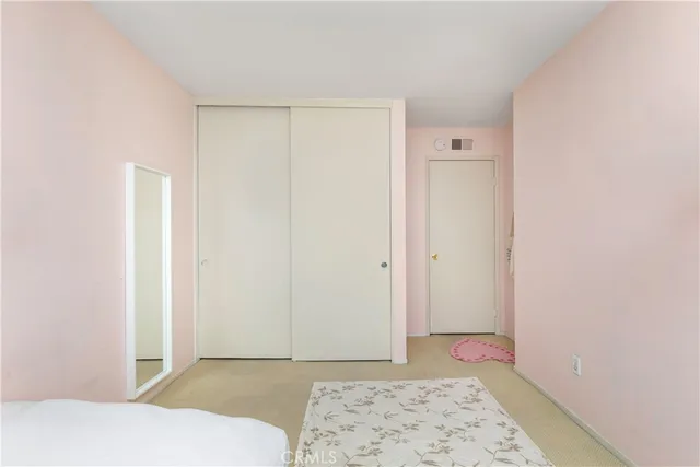 a view of room with window and wooden floor