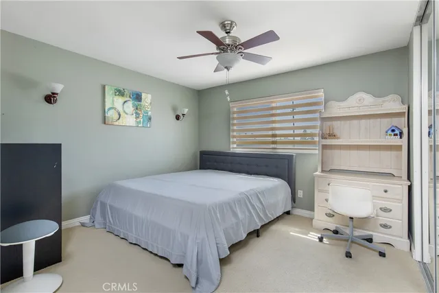 a bedroom with a bed and a table in it