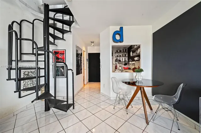 a living room with furniture a air conditioner and a window