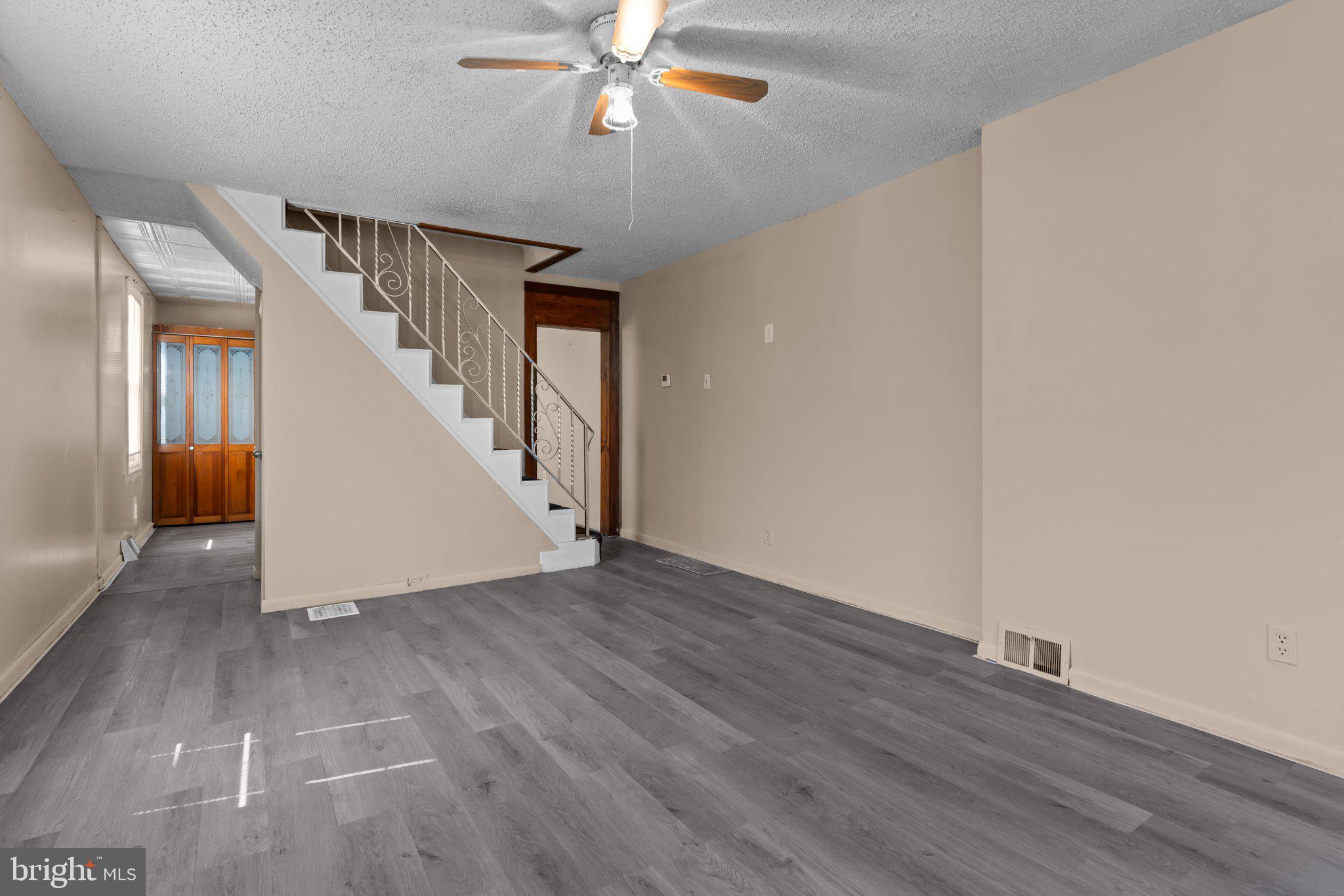 129 Blake Avenue Rockledge, PA 19046 - Photo 3 of 19 wooden floor in an empty room with a chandelier fan