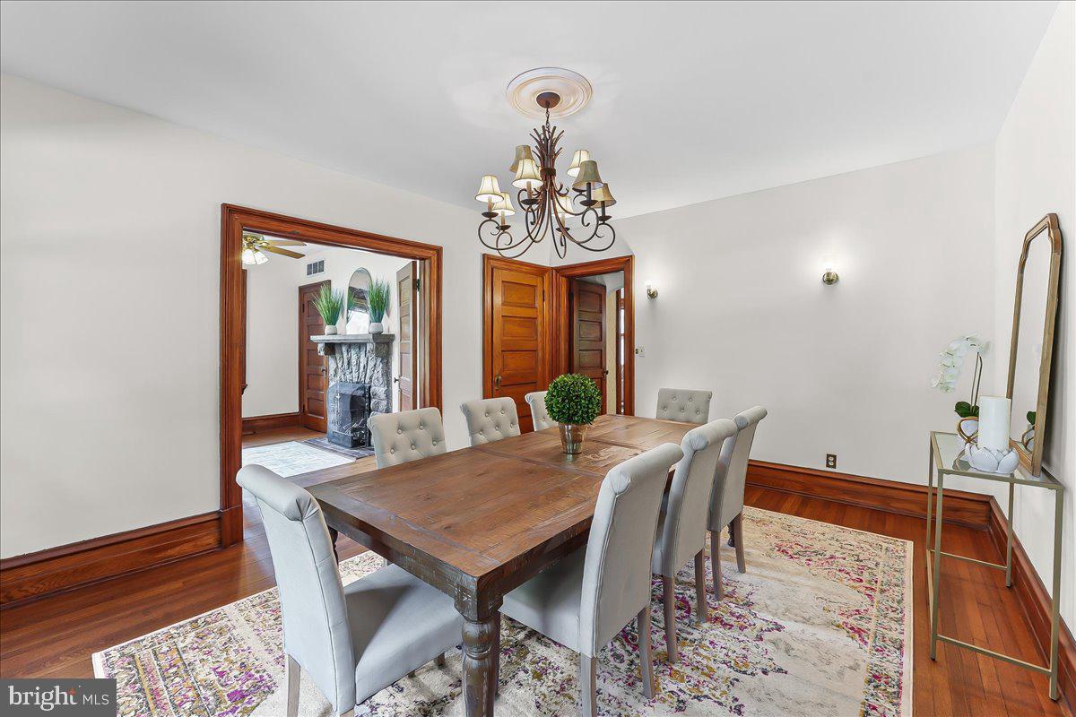 503 West State Street Kennett Square, PA 19348 - Photo 15 of 76 a view of a dining room with furniture and wooden floor