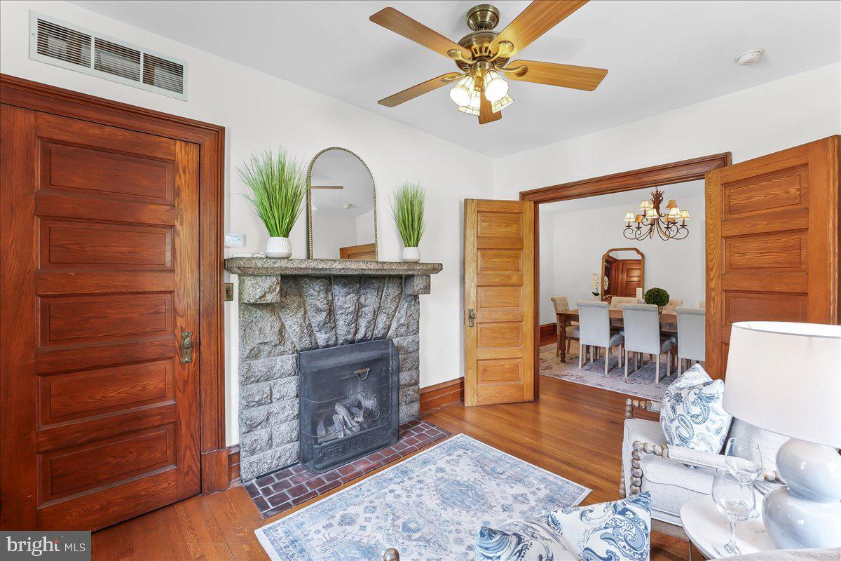503 West State Street Kennett Square, PA 19348 - Photo 17 of 76 a living room with furniture a fireplace and wooden floor