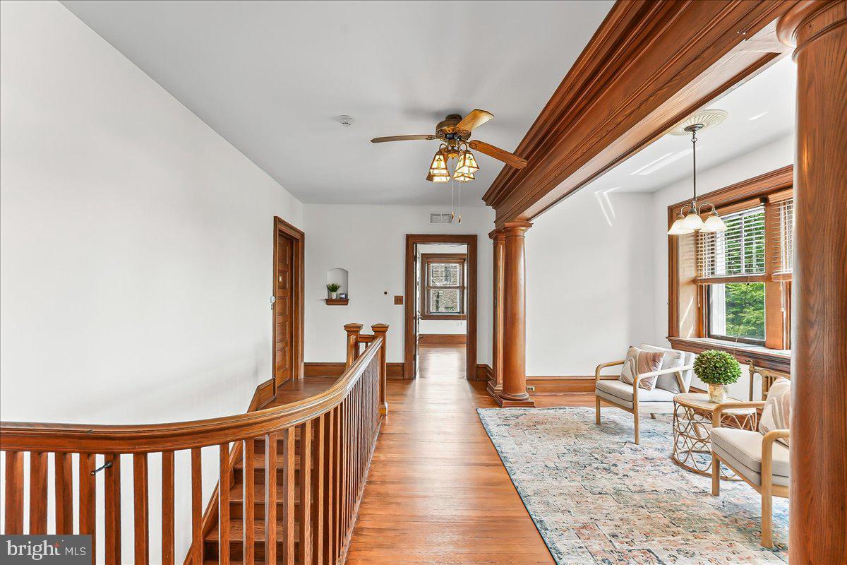 503 West State Street Kennett Square, PA 19348 - Photo 25 of 76 a view of a hallway with wooden floor and windows