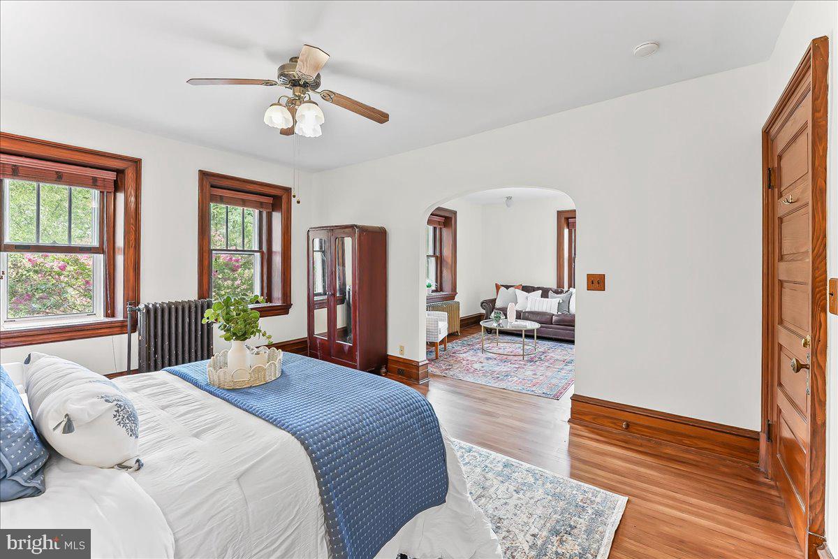 503 West State Street Kennett Square, PA 19348 - Photo 29 of 76 a bedroom with a bed and wooden floor