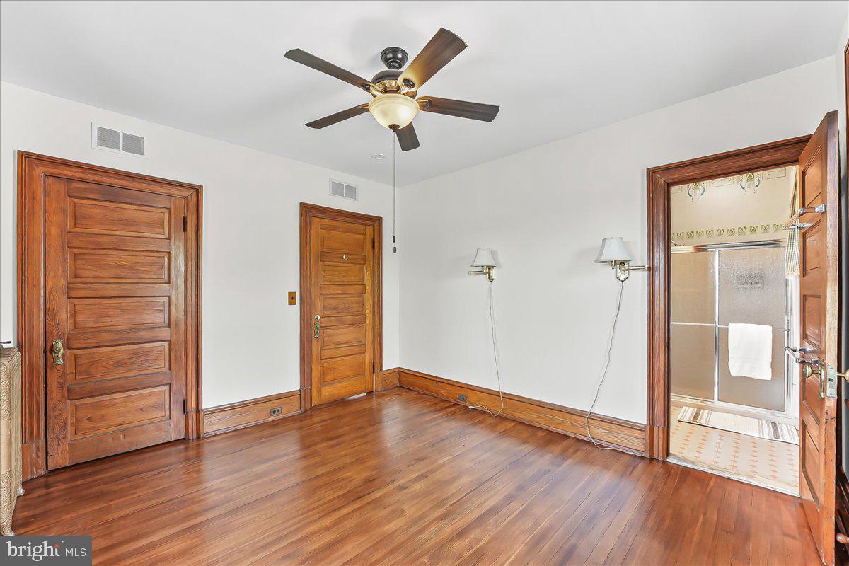 503 West State Street Kennett Square, PA 19348 - Photo 32 of 76 wooden floor in an empty room with a window