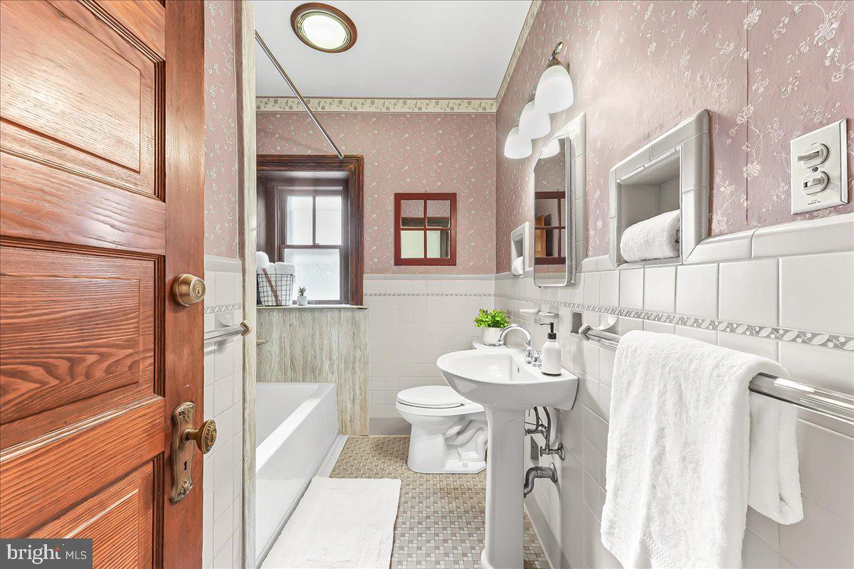 503 West State Street Kennett Square, PA 19348 - Photo 36 of 76 a bathroom with a sink a toilet and shower
