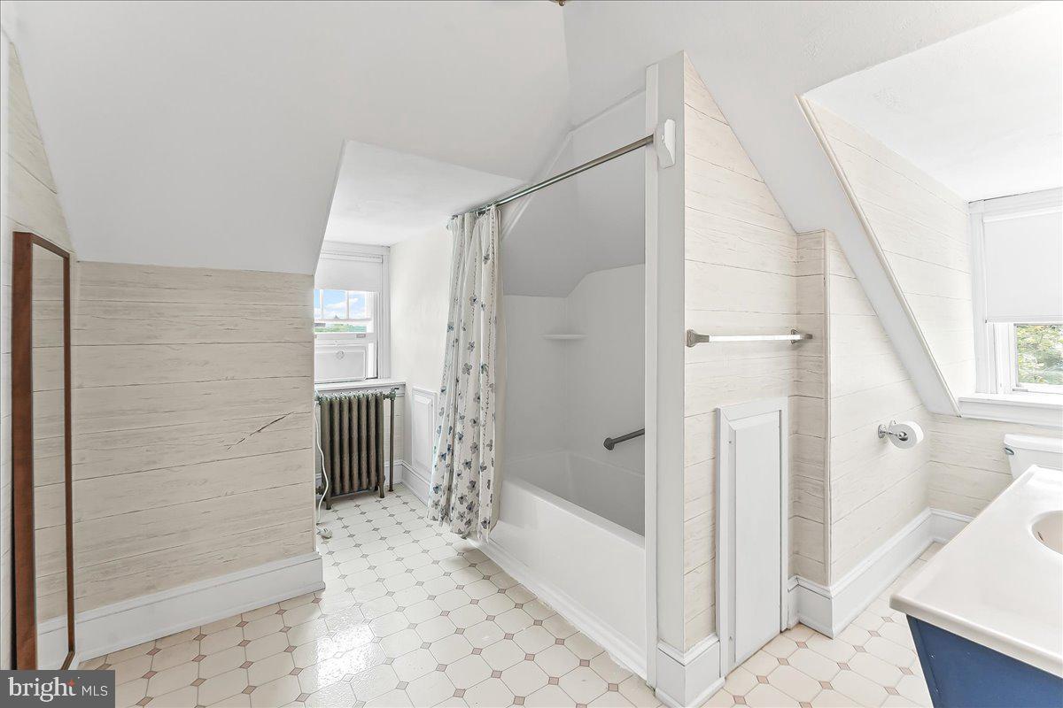 503 West State Street Kennett Square, PA 19348 - Photo 43 of 76 a bathroom with a bathtub and a shower